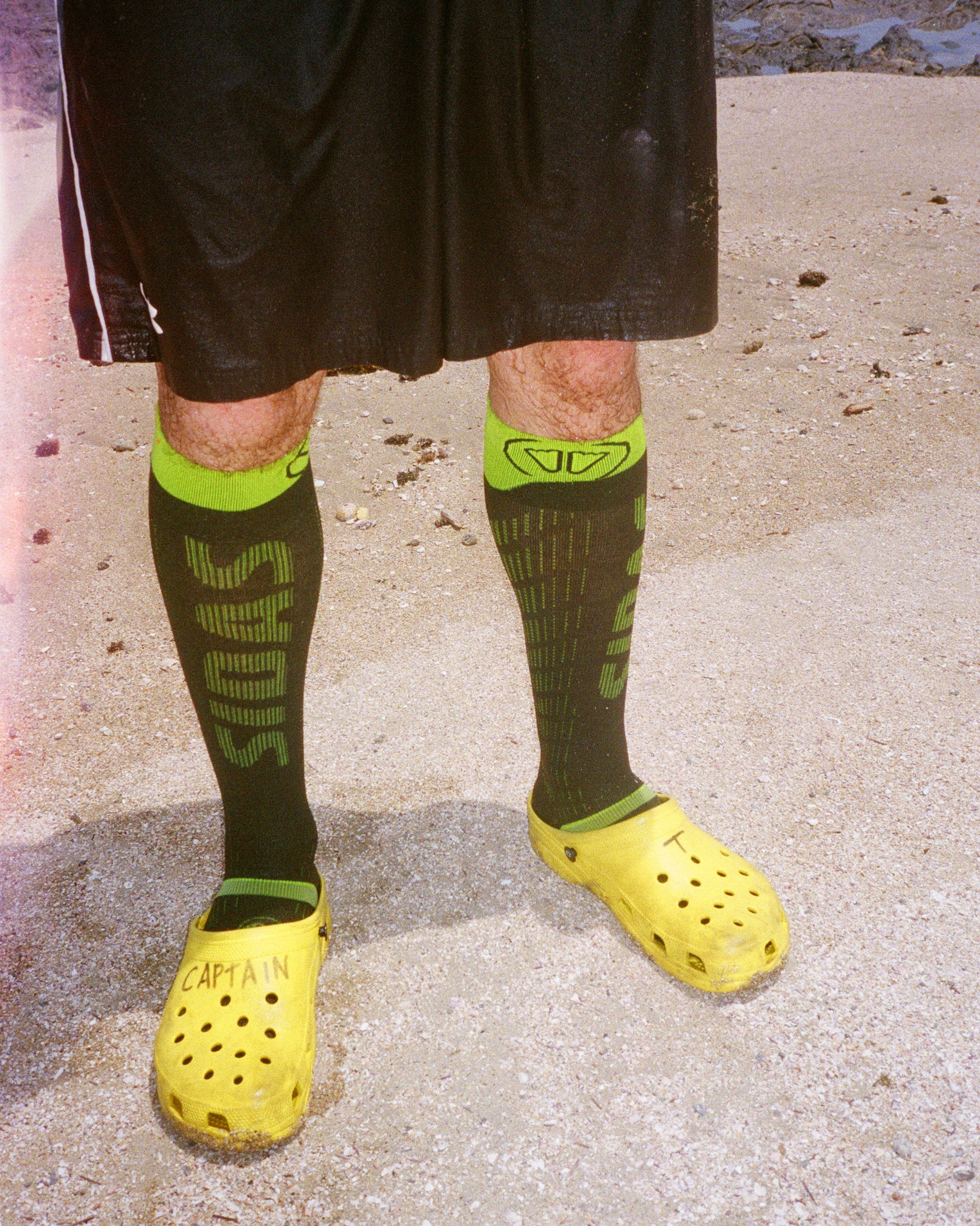 a photo of a some socks and crocs